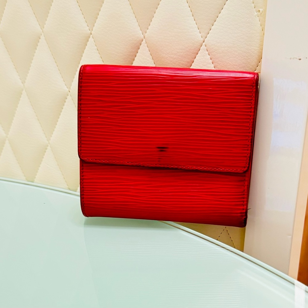 Preowned Preloved Vintage Red epi leather Louis Vuitton trifold wallet.